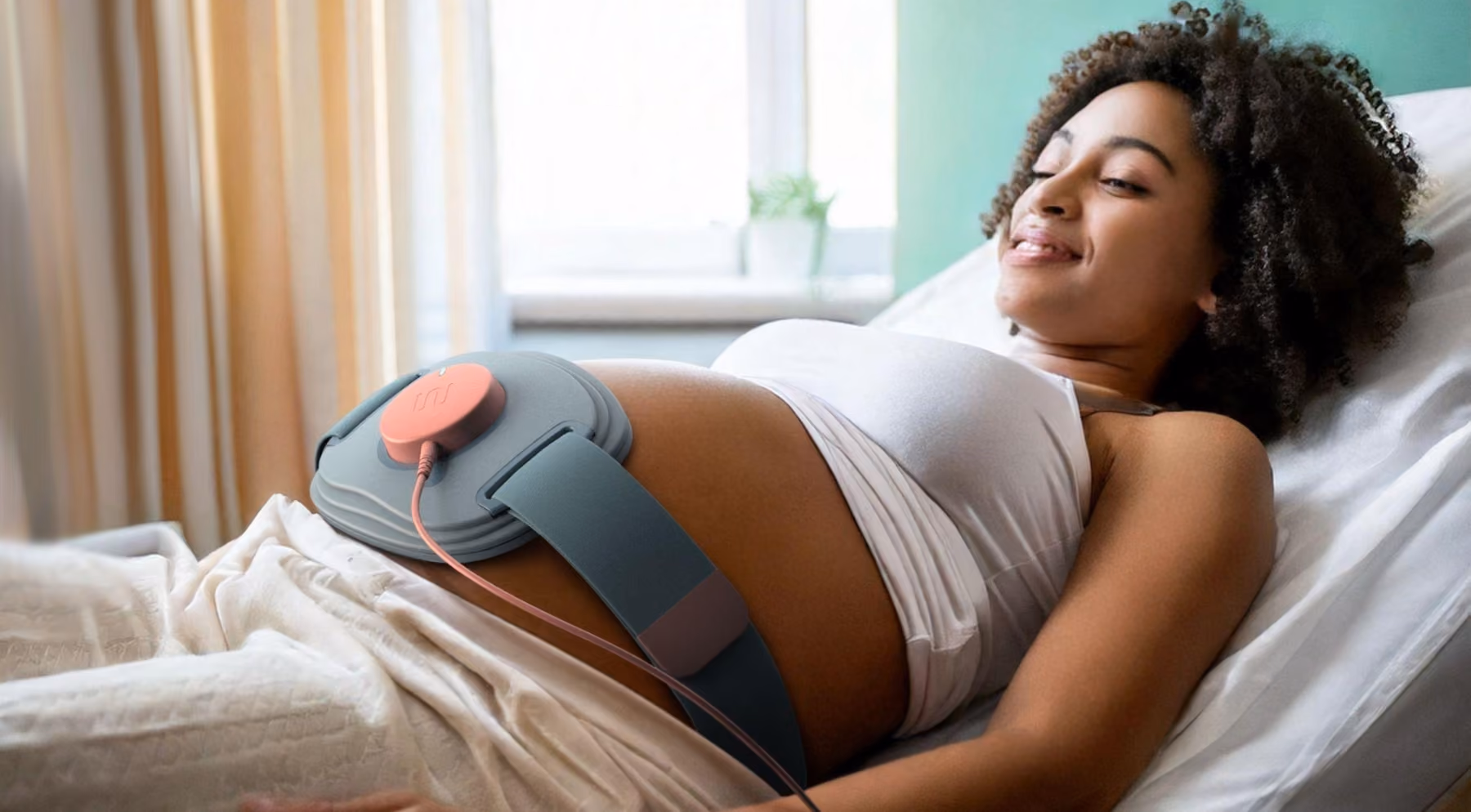 Patient wearing the Wavelet Medical device in a hospital setting.