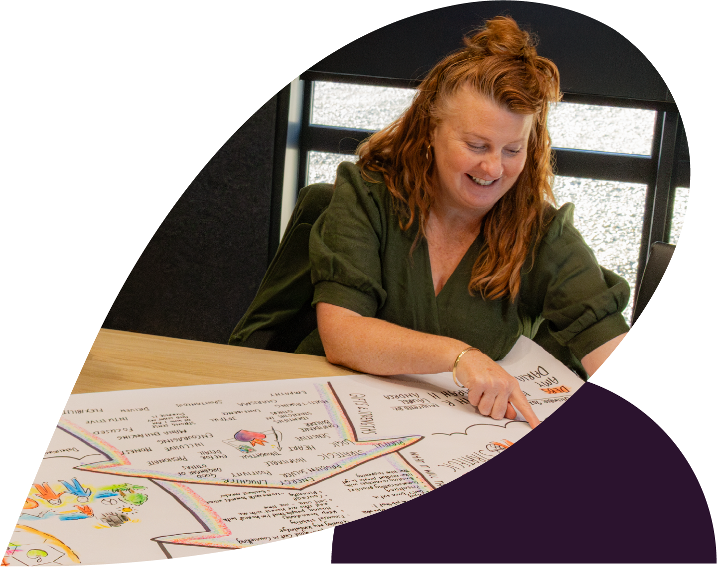 Mother and father holding daughter in front of house
