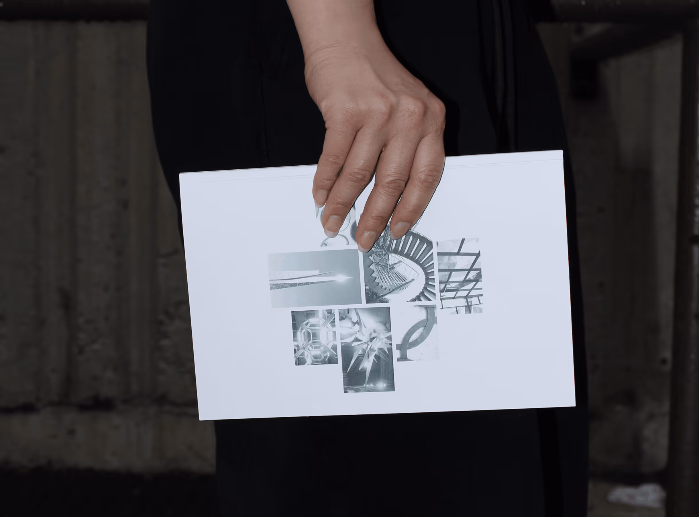 Hand holding publication book.