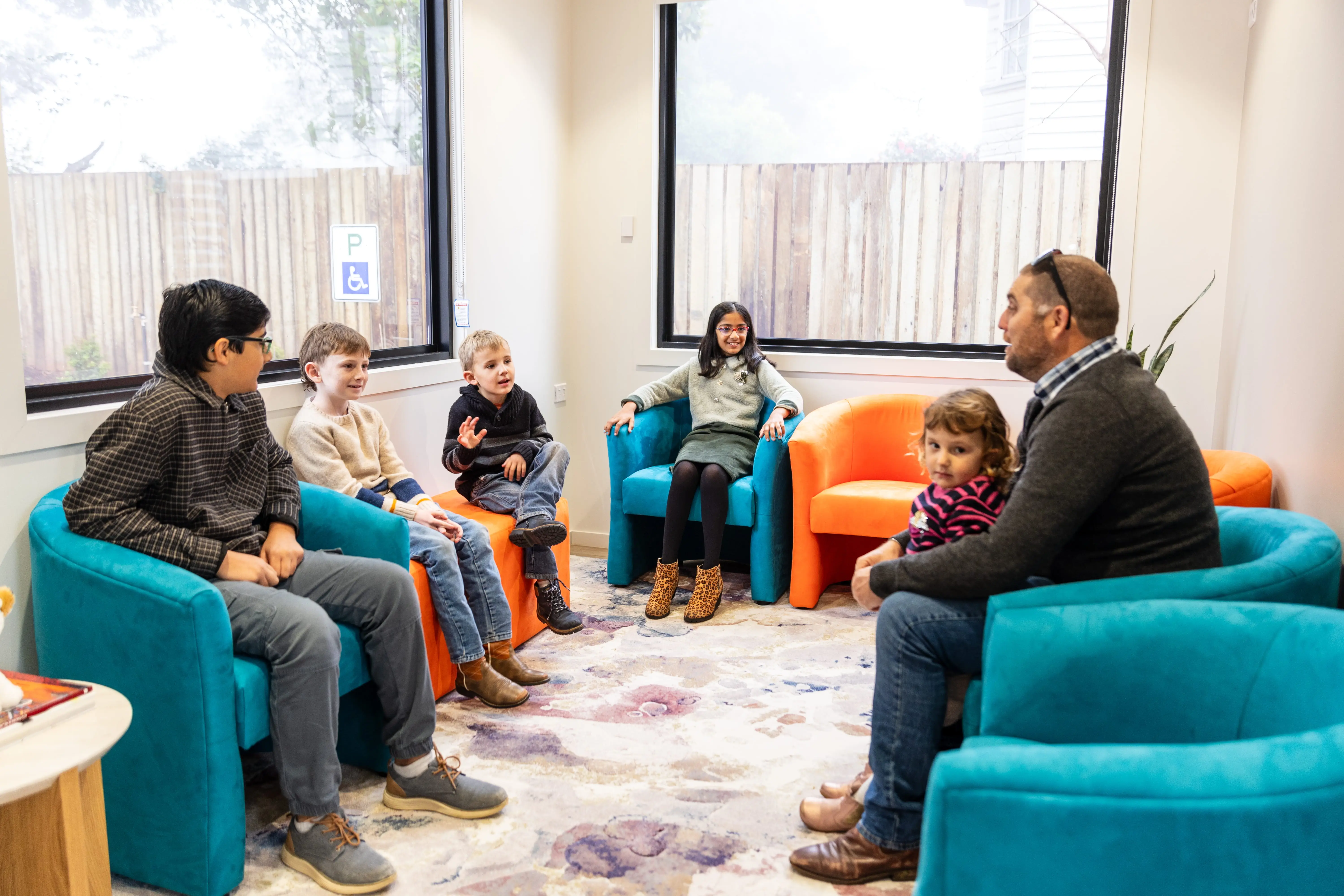Families and children waiting in the comfortable reception area at Forever Dental & Smile Centre.