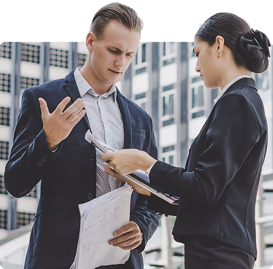 Two Realtor discussing documents