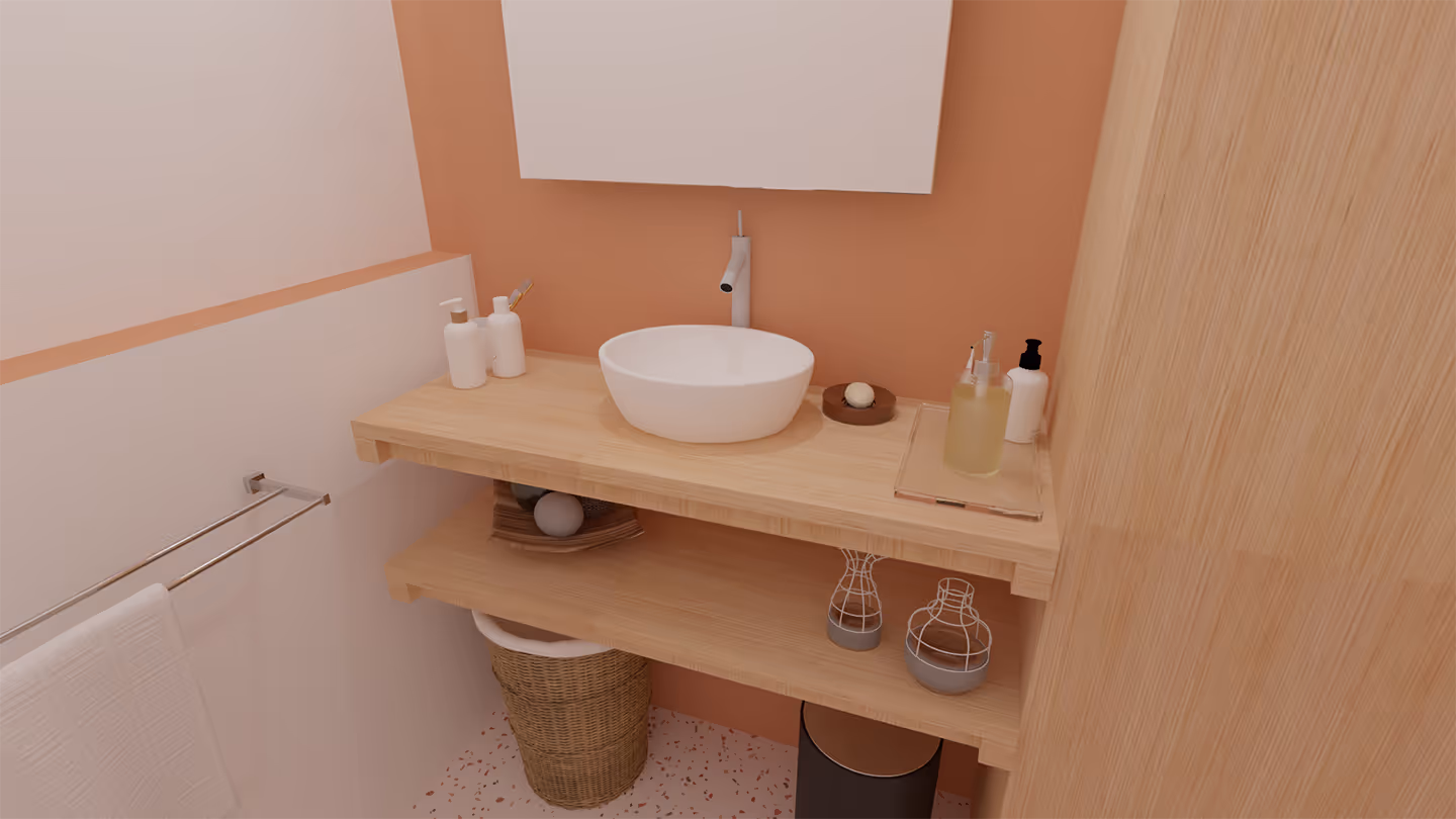 Salle de bain aux tons roses équipée d'un miroir, d'un lavabo et d'un porte-serviettes.