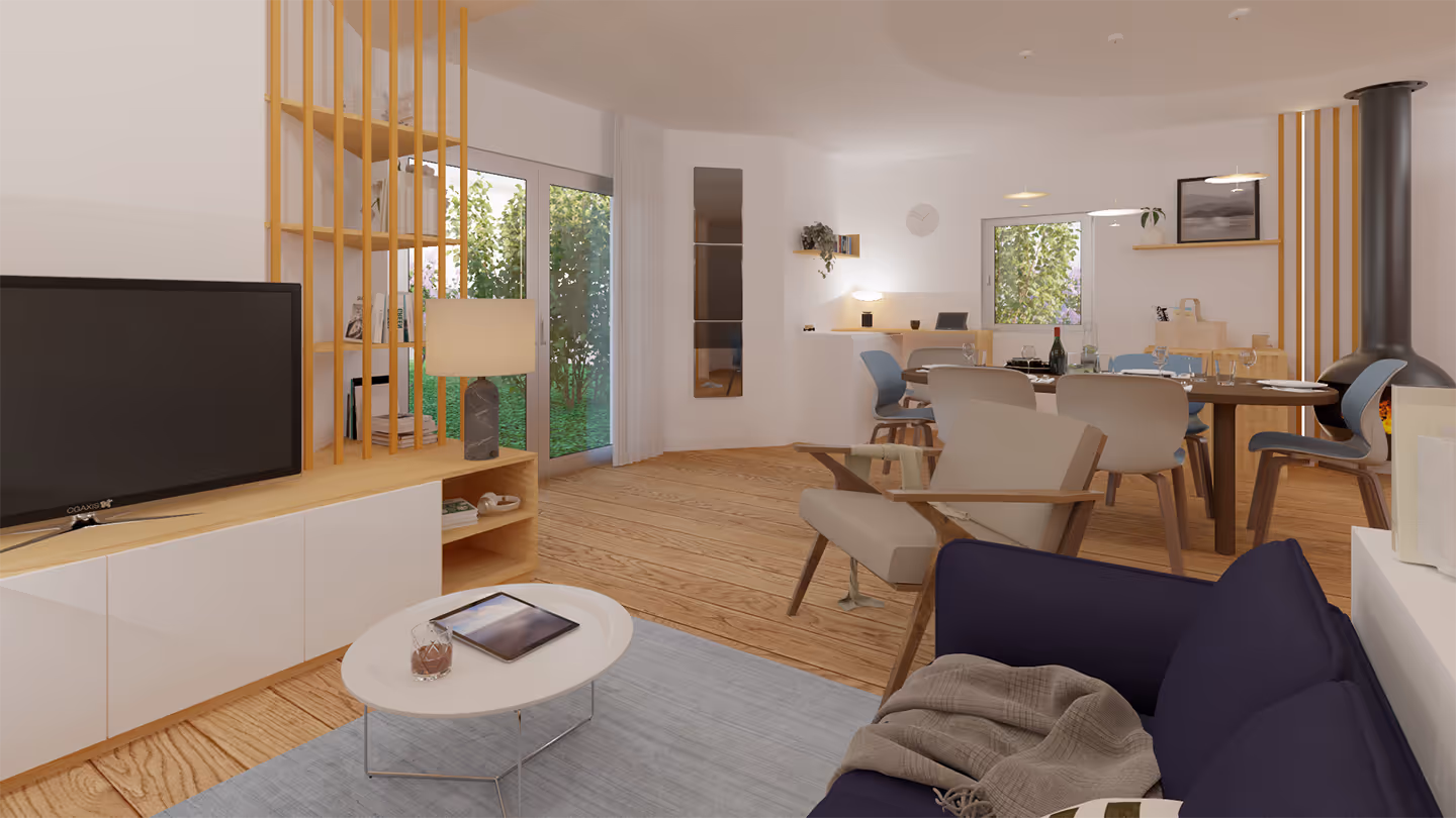 Un salon moderne comprenant un canapé, une table basse et une télévision, parfait pour se détendre.