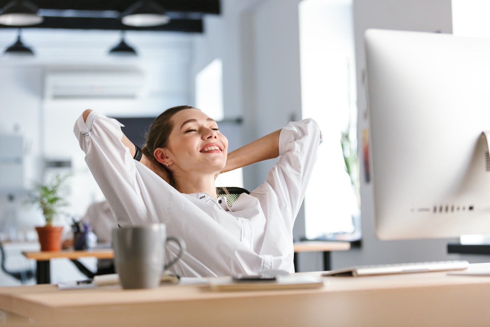 Woman relaxing in front of computer