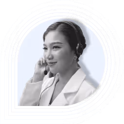 Woman smiling while talking on the phone, framed by blue curved lines.