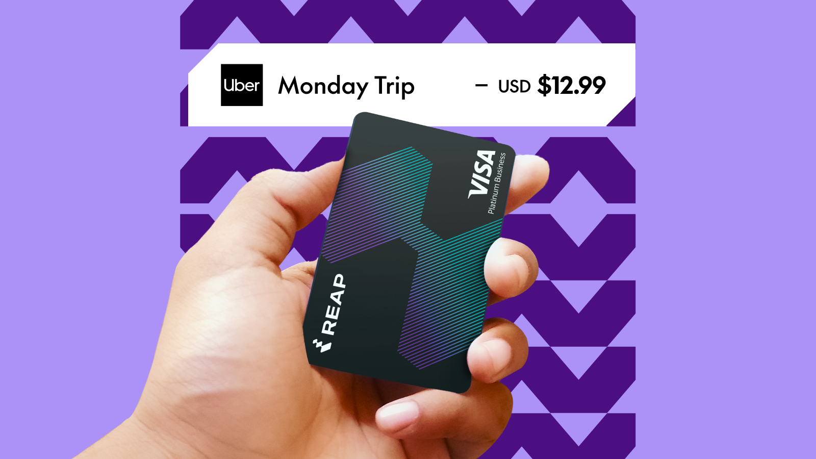 Hand holding a REAP Visa Platinum Business card with a purple patterned background and Uber trip cost of $12.99.