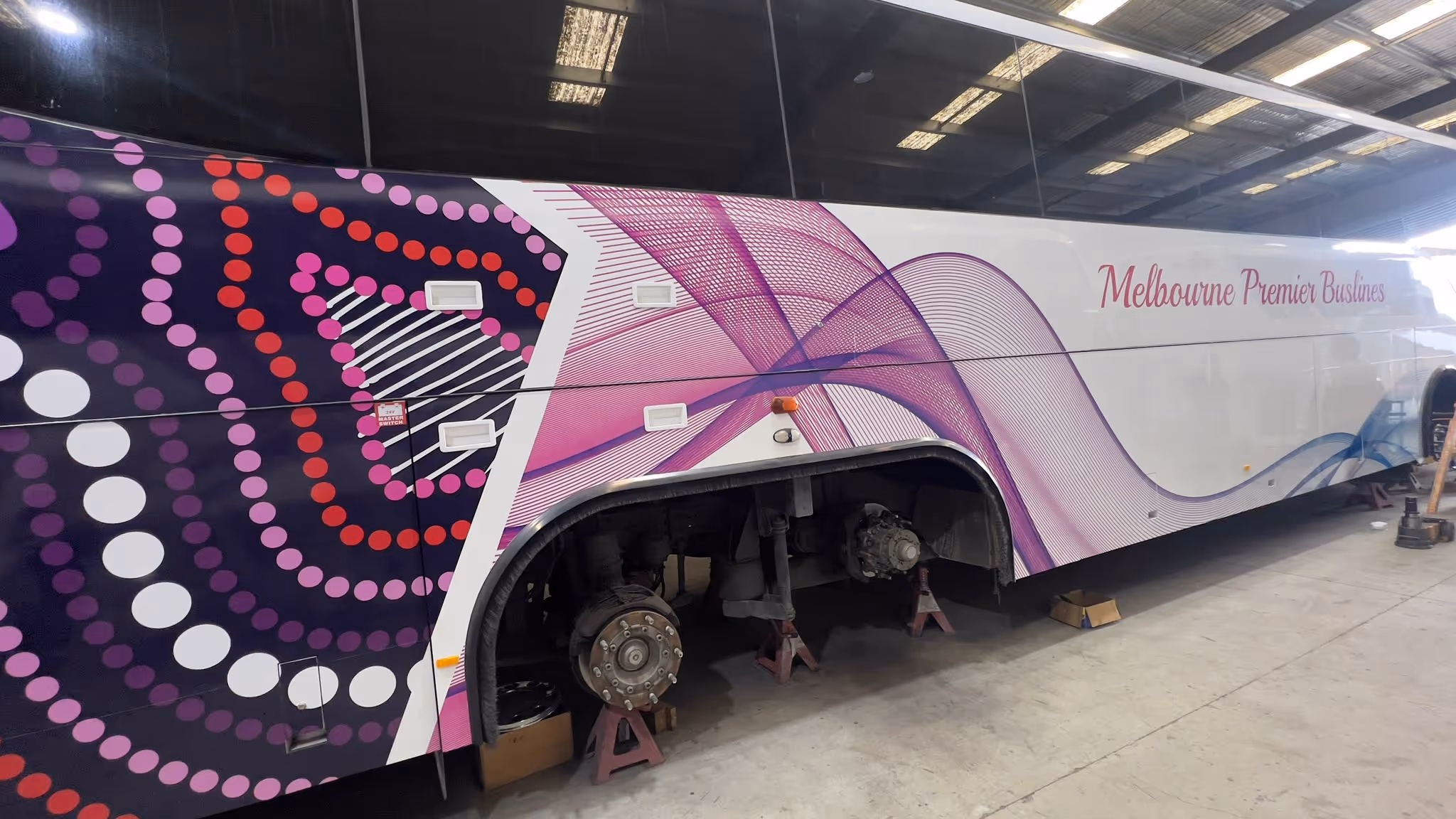 a bus with purple and white design