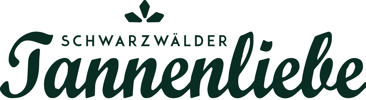 Logo Schwarzwälder Tannenliebe – grüner Schriftzug mit stilisierten Tannenzweigen