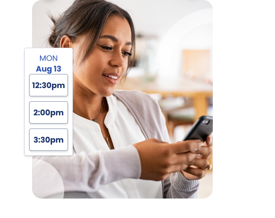 A woman looking at her cell phone. - Hopscotch Images