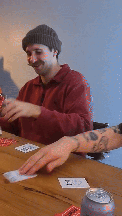 A male in a beanie playing CockFight!