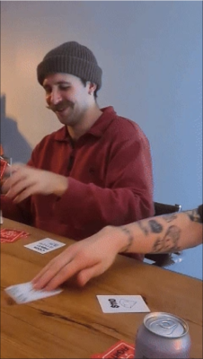A male in a beanie playing CockFight!