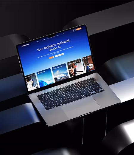 A laptop displaying a blue-themed webpage titled 'Your logistics assistant: Genie AI' with navigation and service cards below on a reflective black surface.