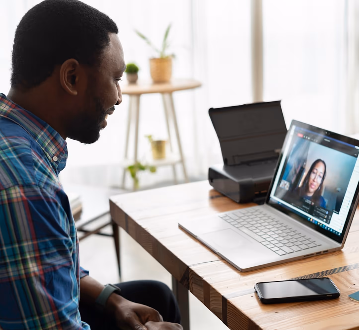 Two people conversing over a video call / chat