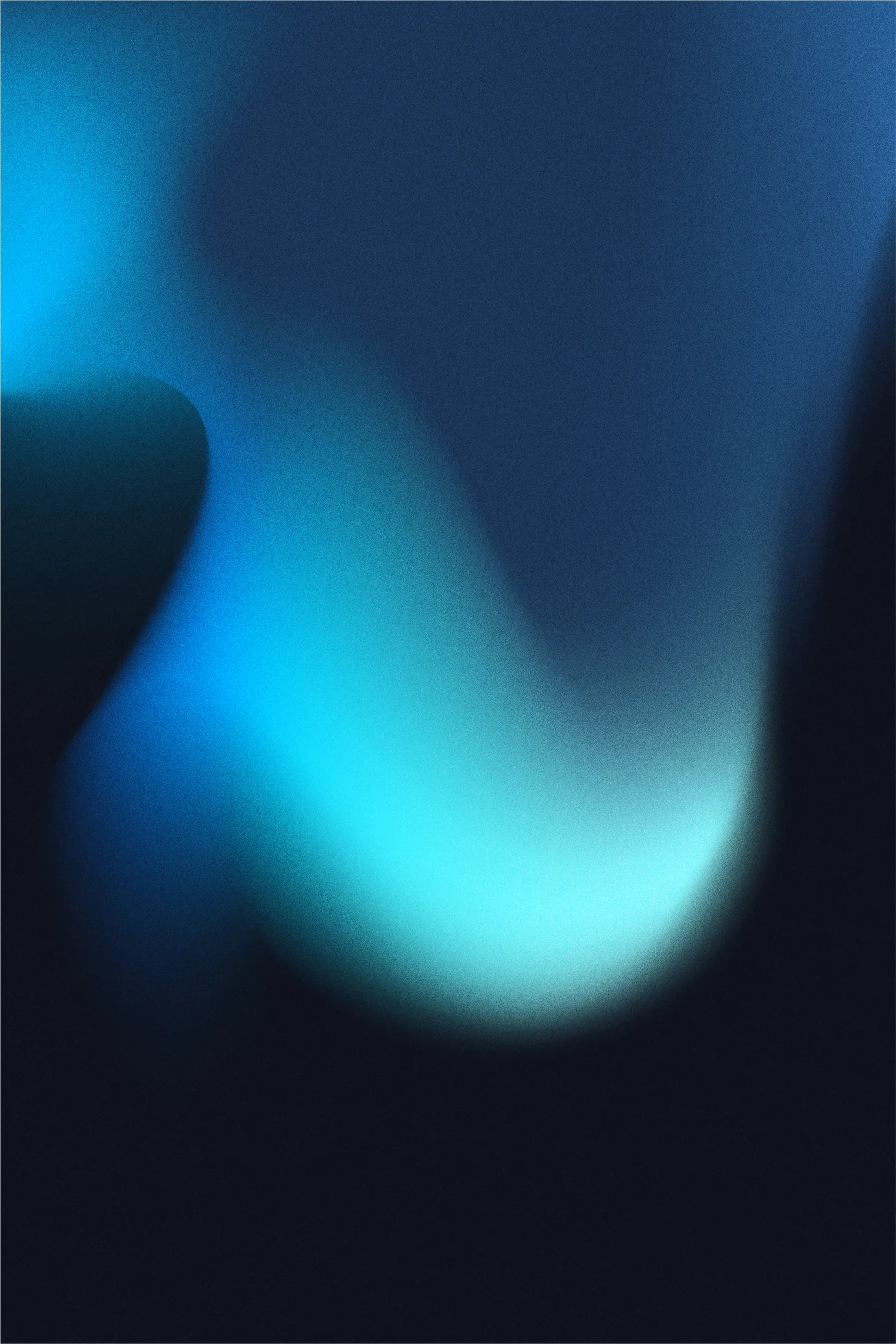 Abstract soft gradient of blue and black colors blending smoothly with a glowing effect.