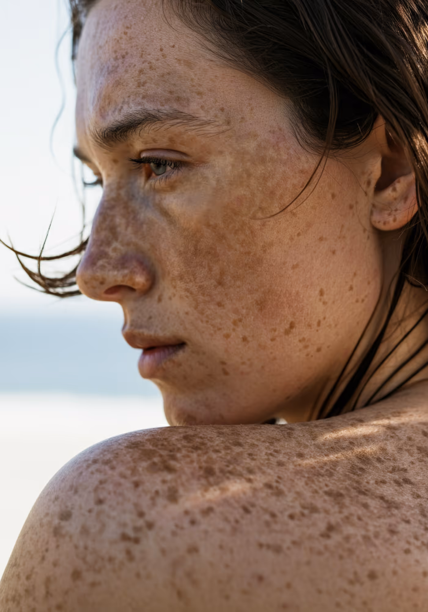 Close-up profile of freckled woman