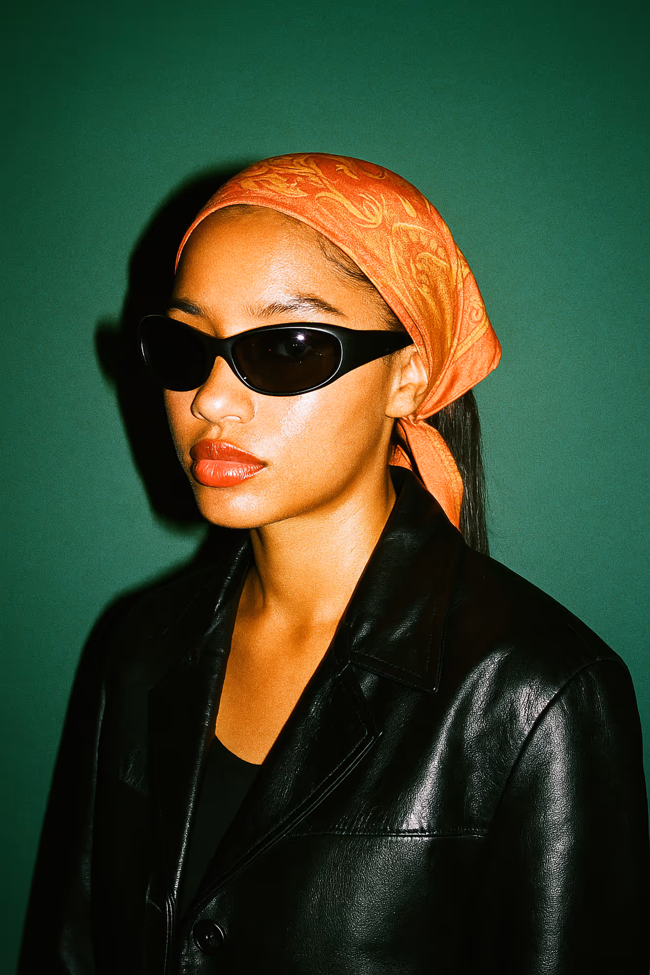 Woman wearing scarf and sunglasses