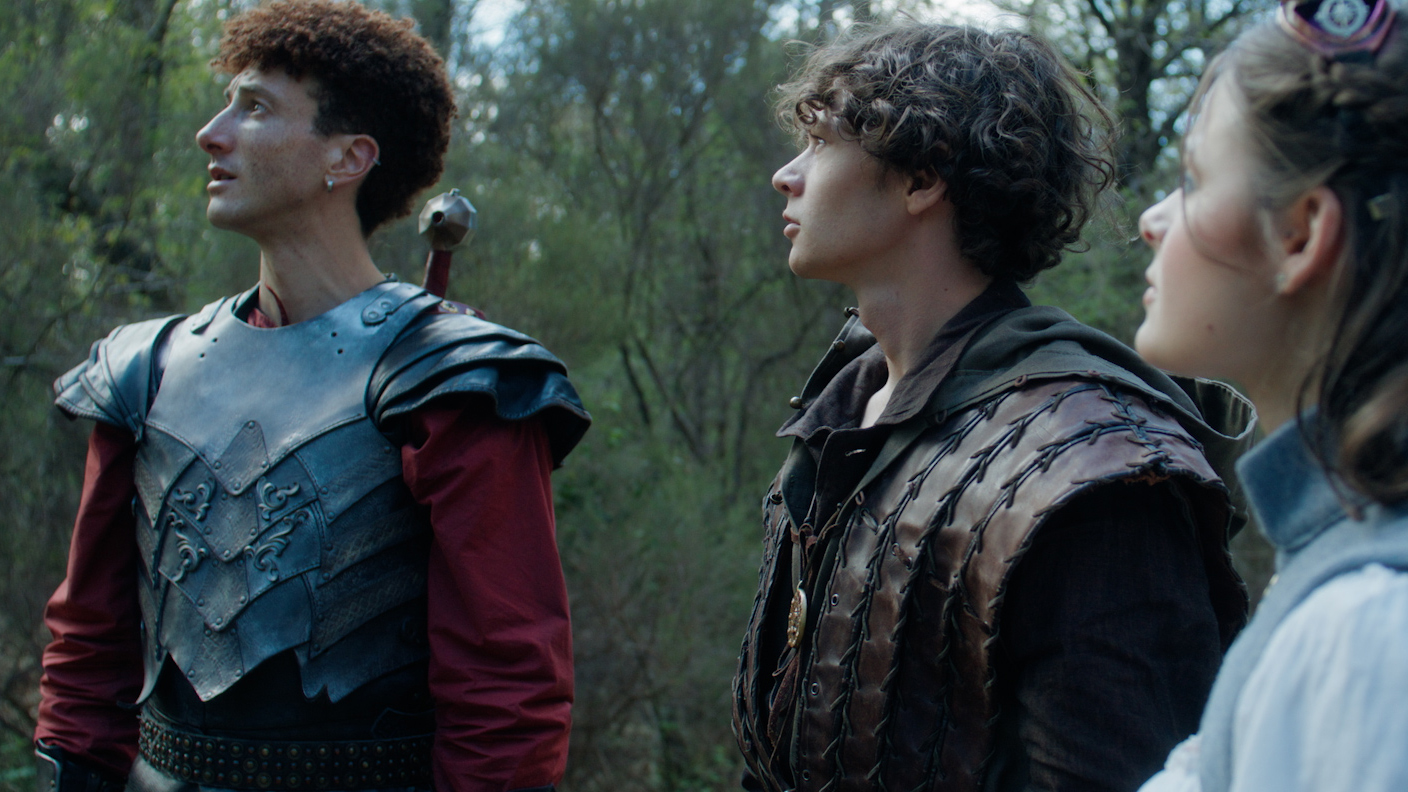 Trois protagonistes lèvent la tête vers le ciel, couverture du projet JDR