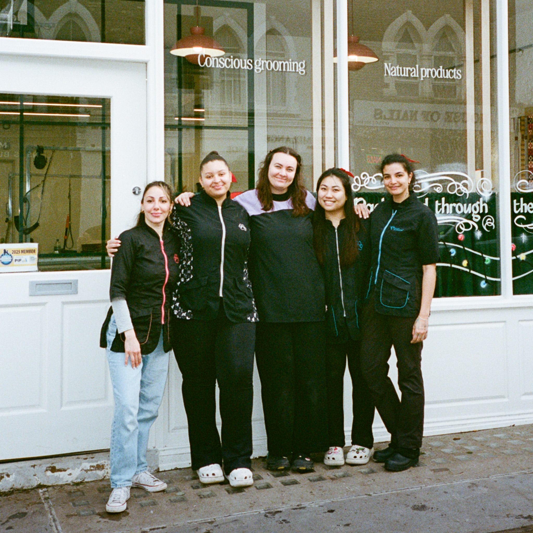 The Hackney Barkers dog grooming team outside the salon on Chatsworth Road