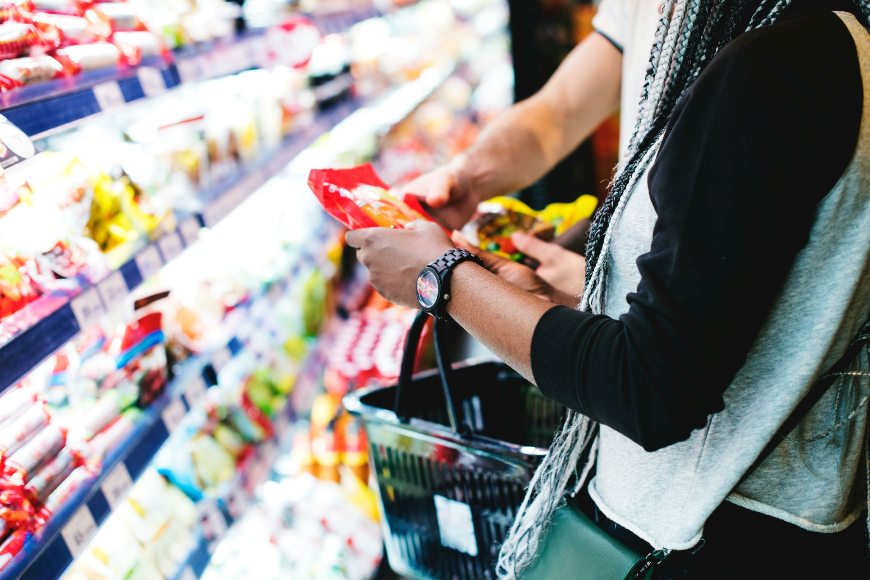 Image of a person shopping for consumer goods at a grocery store

