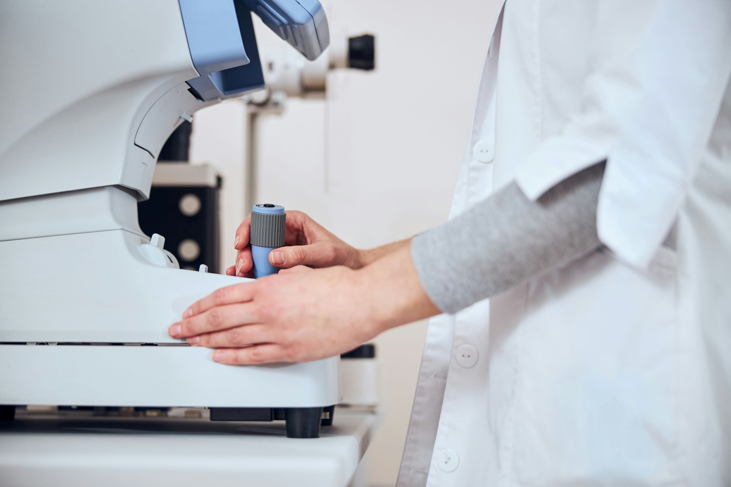 Lab technician using optometry equipment

