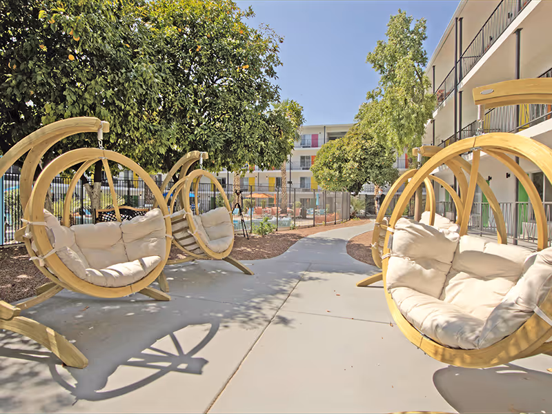 Swing chairs in courtyard