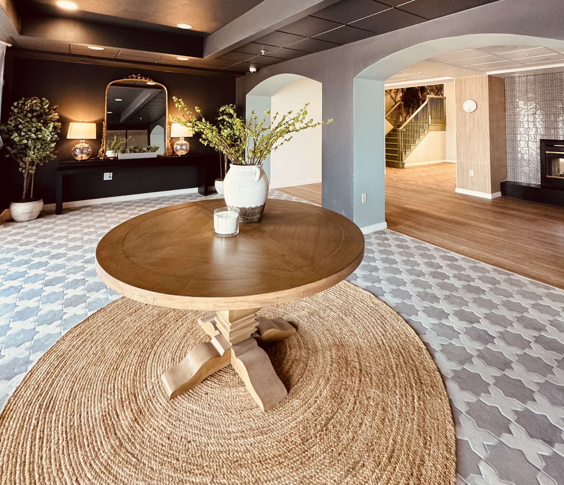 Converted hotel lobby at Ainsley Dallas showing modern apartment common area