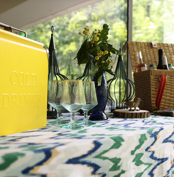 A Goldfinch photo of a picnic with a yellow cooler.