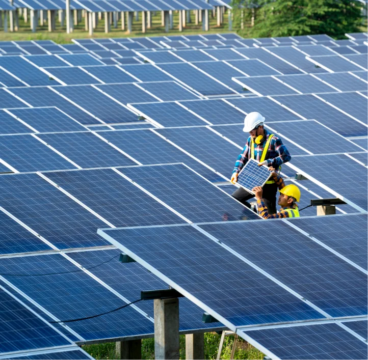 Technician installing solar panels on Indiana commercial farmEmergent Solar
