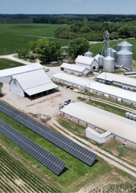 Close-up view of a farm in Indiana with solar panels generating renewable energy for agricultural operations