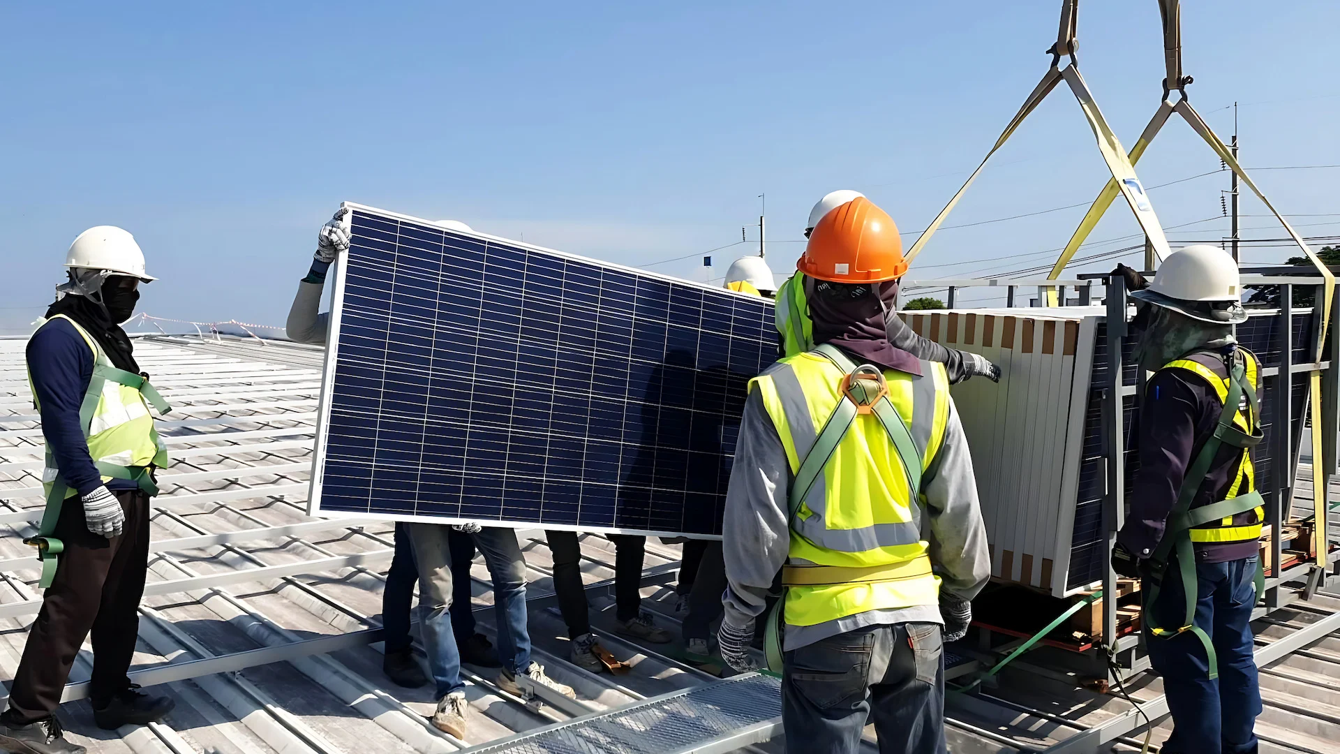 Team of technicians installing solar panels on a commercial site in Indiana for a large-scale renewable energy project