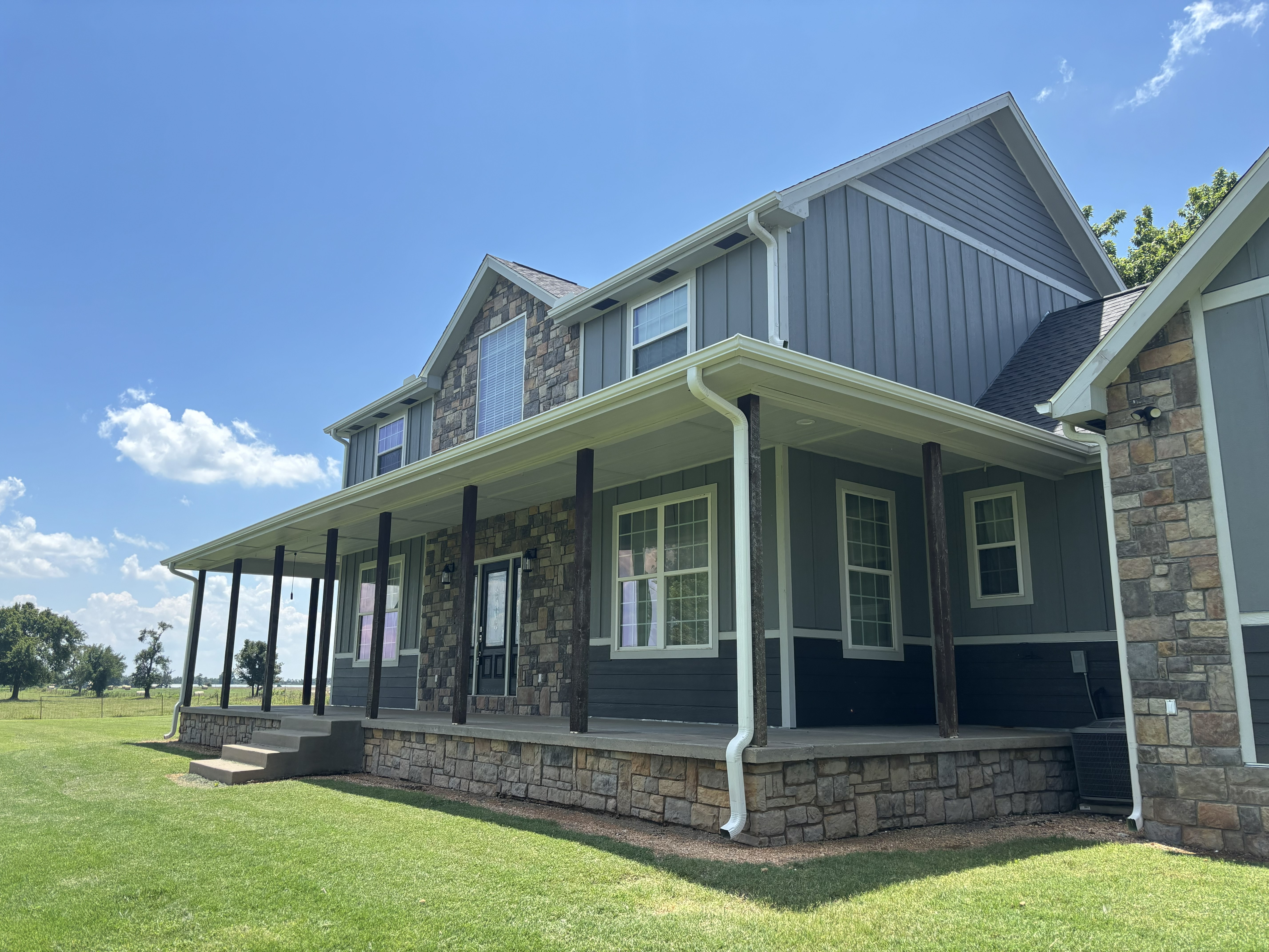 Dogwood Gutters installation of seamless gutters on a home in Bella Vista, AR.