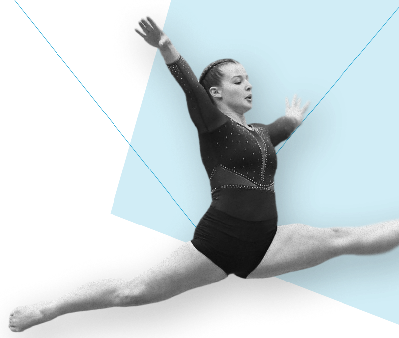 Gymnast performing a split leap with arms raised and focused expression on a blue background.