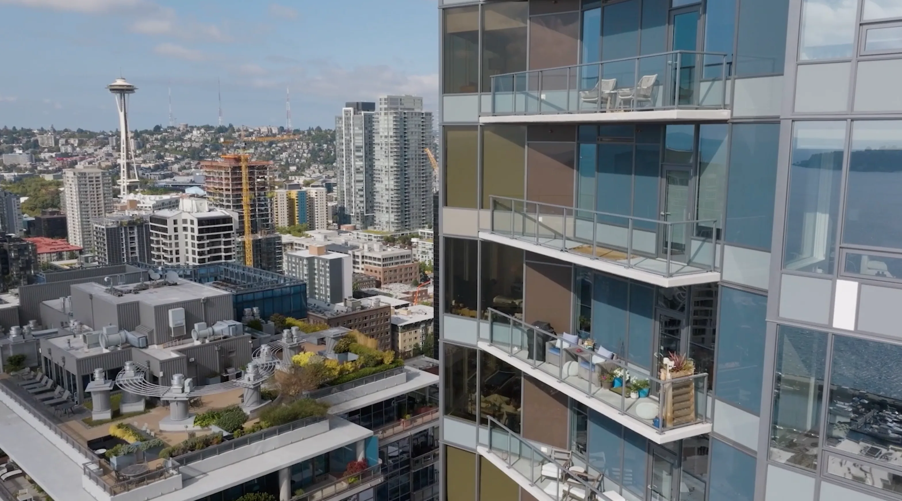Railcraft International high-rise balcony with cable railing overlooking Seattle skyline