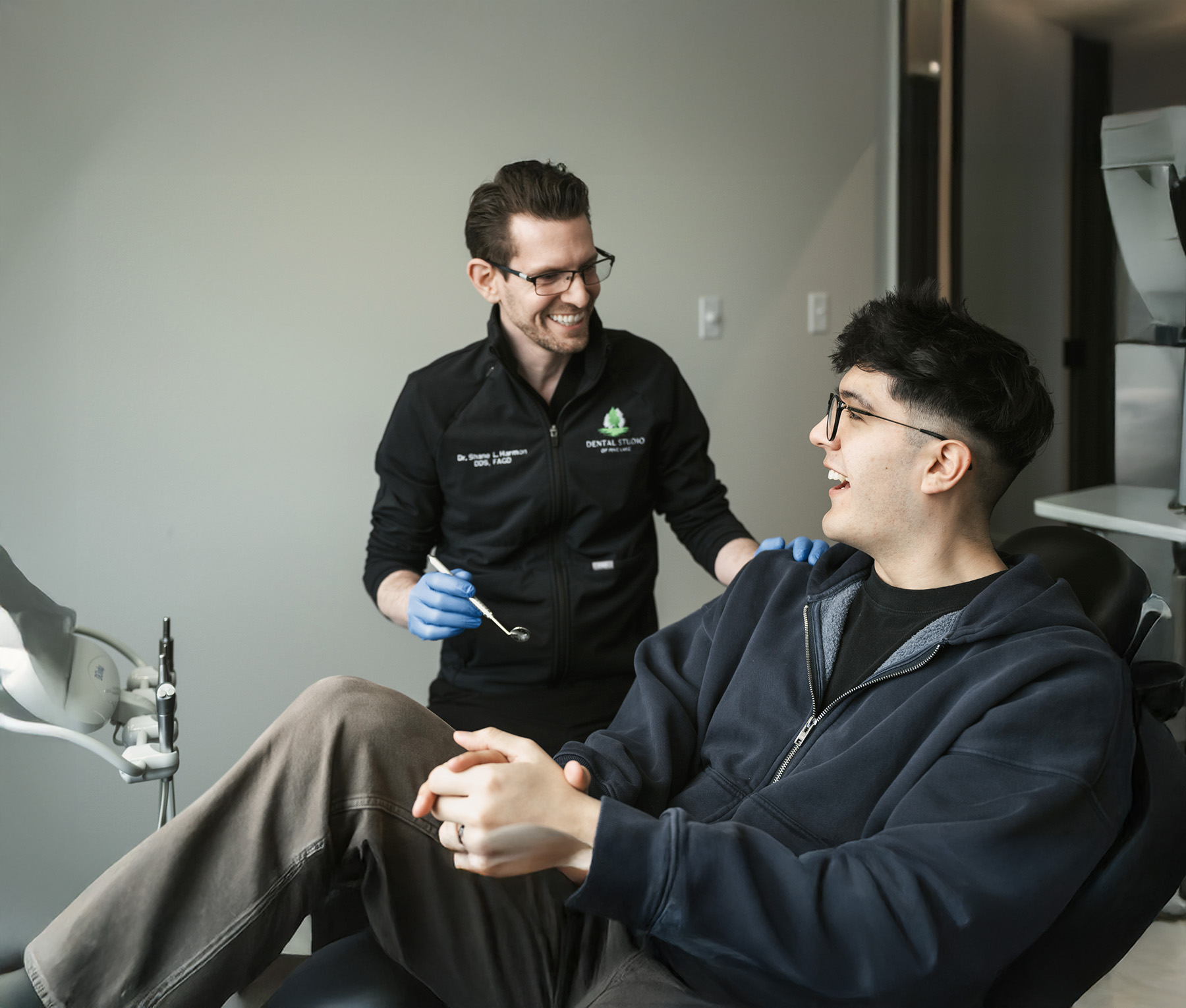 Dentist smiling with patient