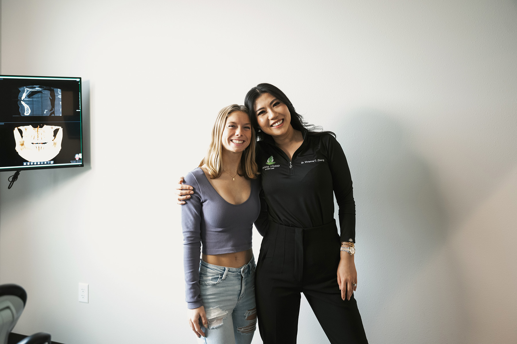 Dentist smiling with patient