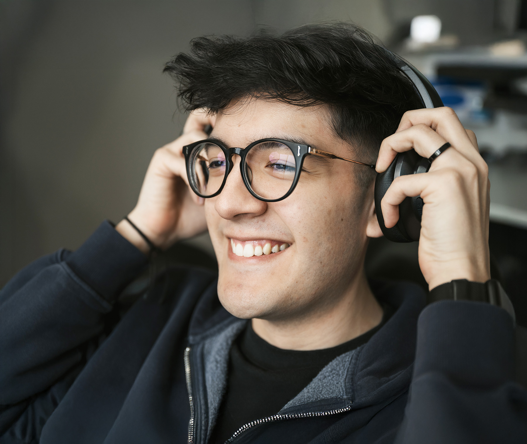 Patient wearing headphones smiling