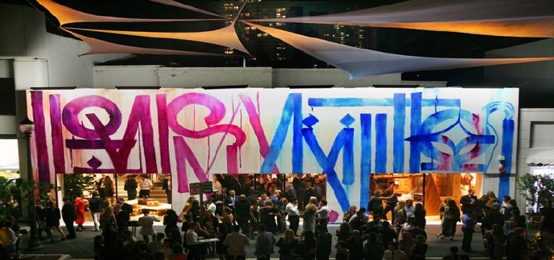 RETNA mural on Louis Vuitton storefront, evening event