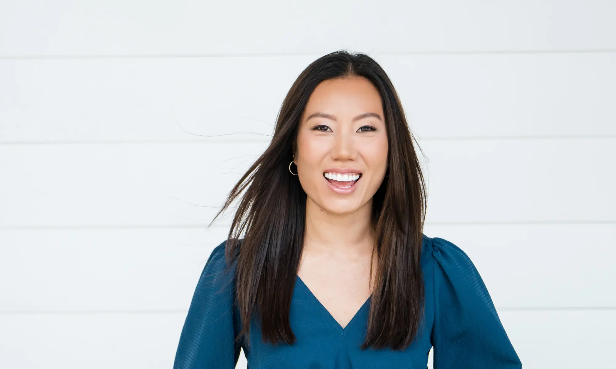 Woman smiling confidently after clear aligner treatment at Espire Dental Casper.