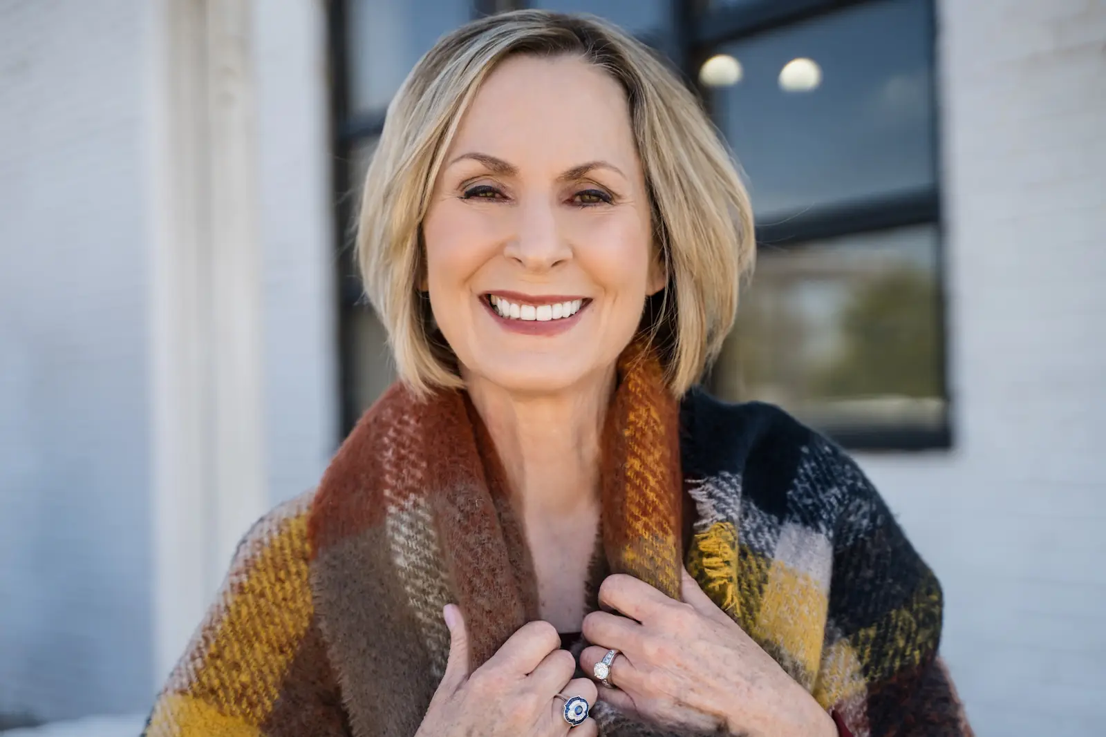 Smiling senior woman outdoors showing her bright, healthy smile after dental care at Espire Dental.