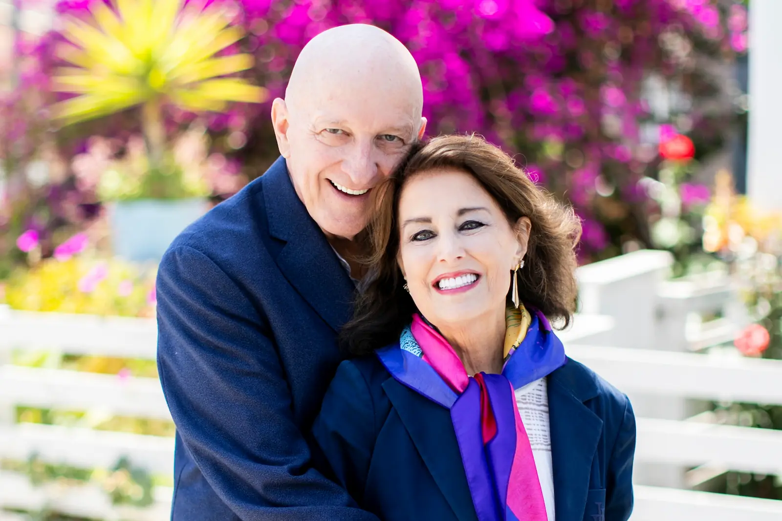 Smiling senior couple enjoying a sunny day together after receiving dental care at Espire Dental.