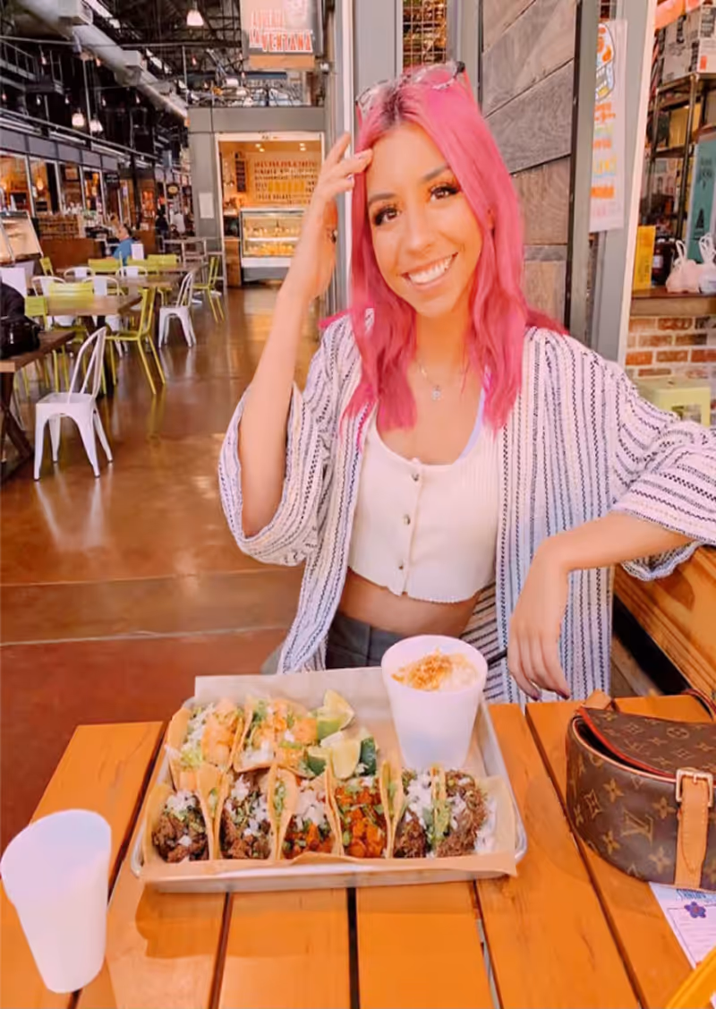 Guest enjoying tacos at Taqueria La Ventana
