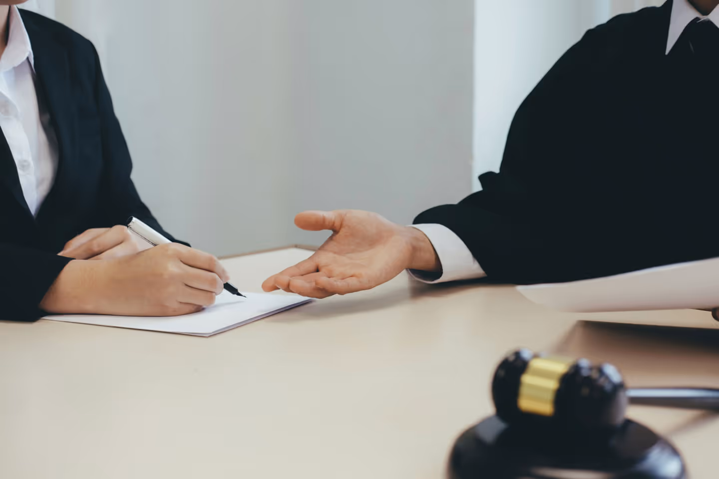 A couple of people that are sitting at a table.