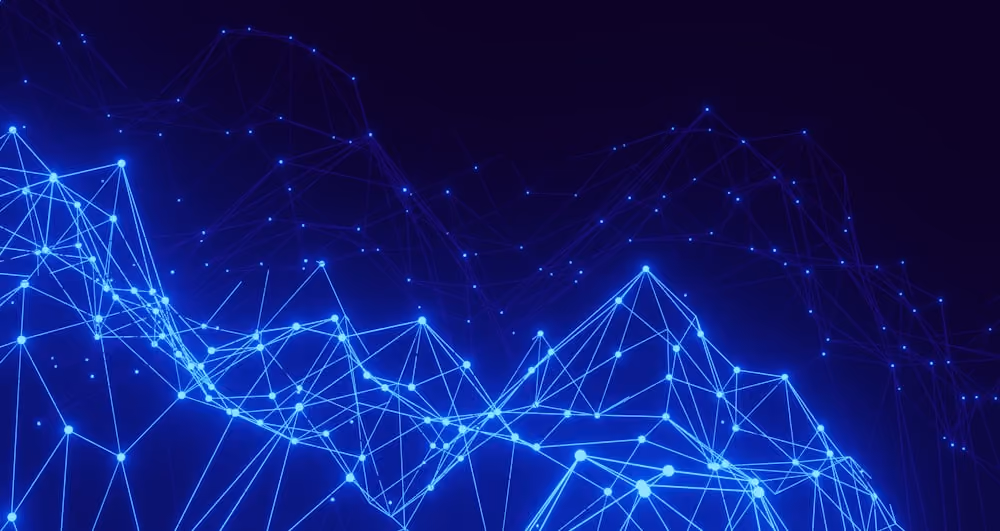 Blue glowing network of interconnected dots and lines forming a 3D mesh on a dark background.