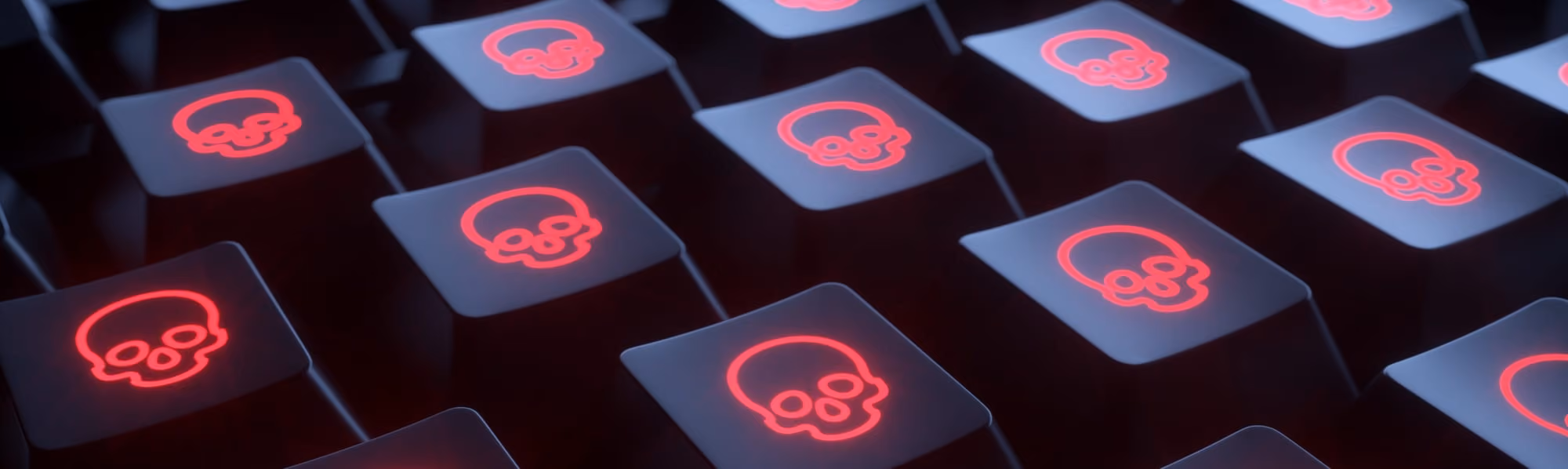 Close-up of black keyboard keys illuminated with red skull icons suggesting cyber threats.