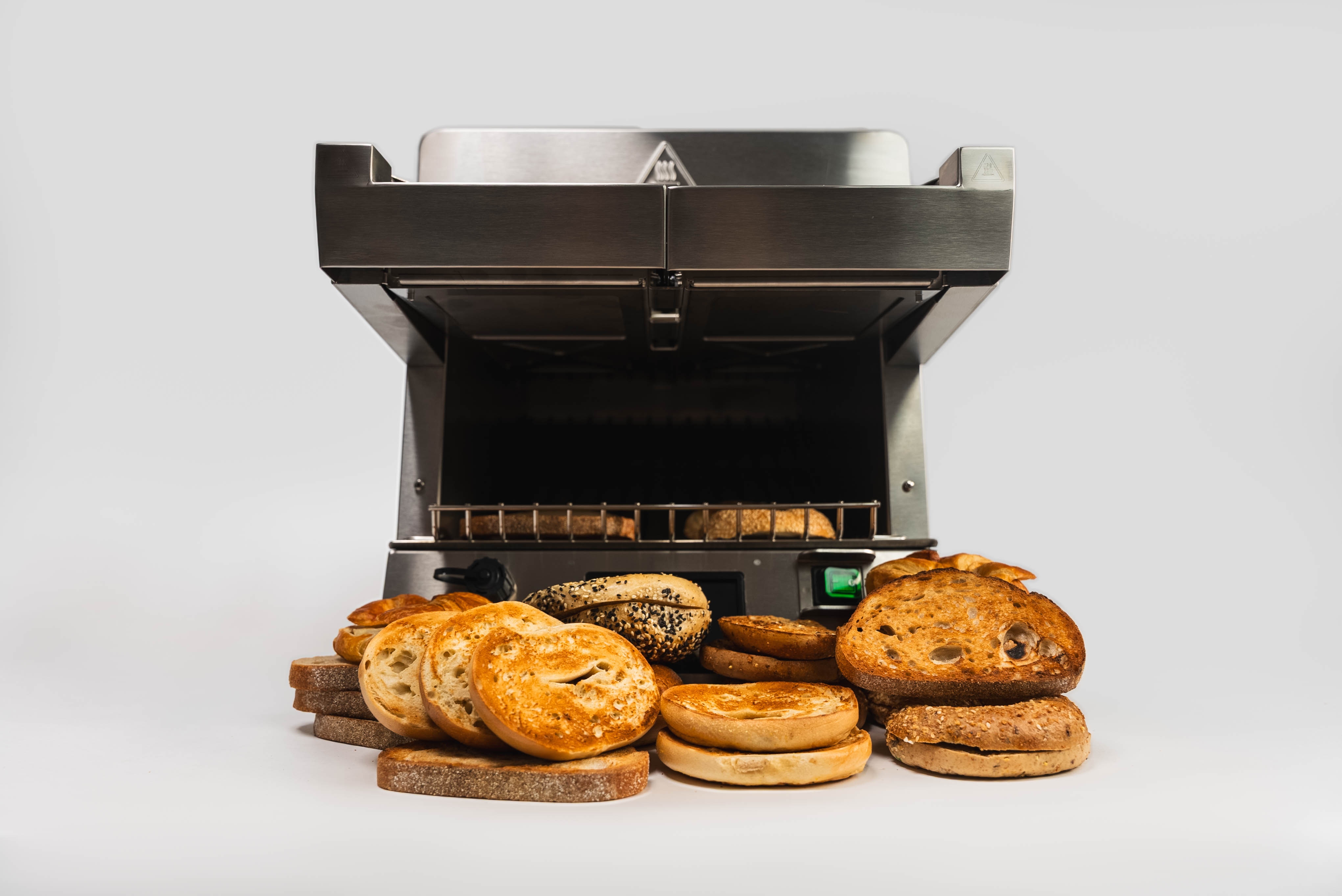 toast ez behind a stack of breads