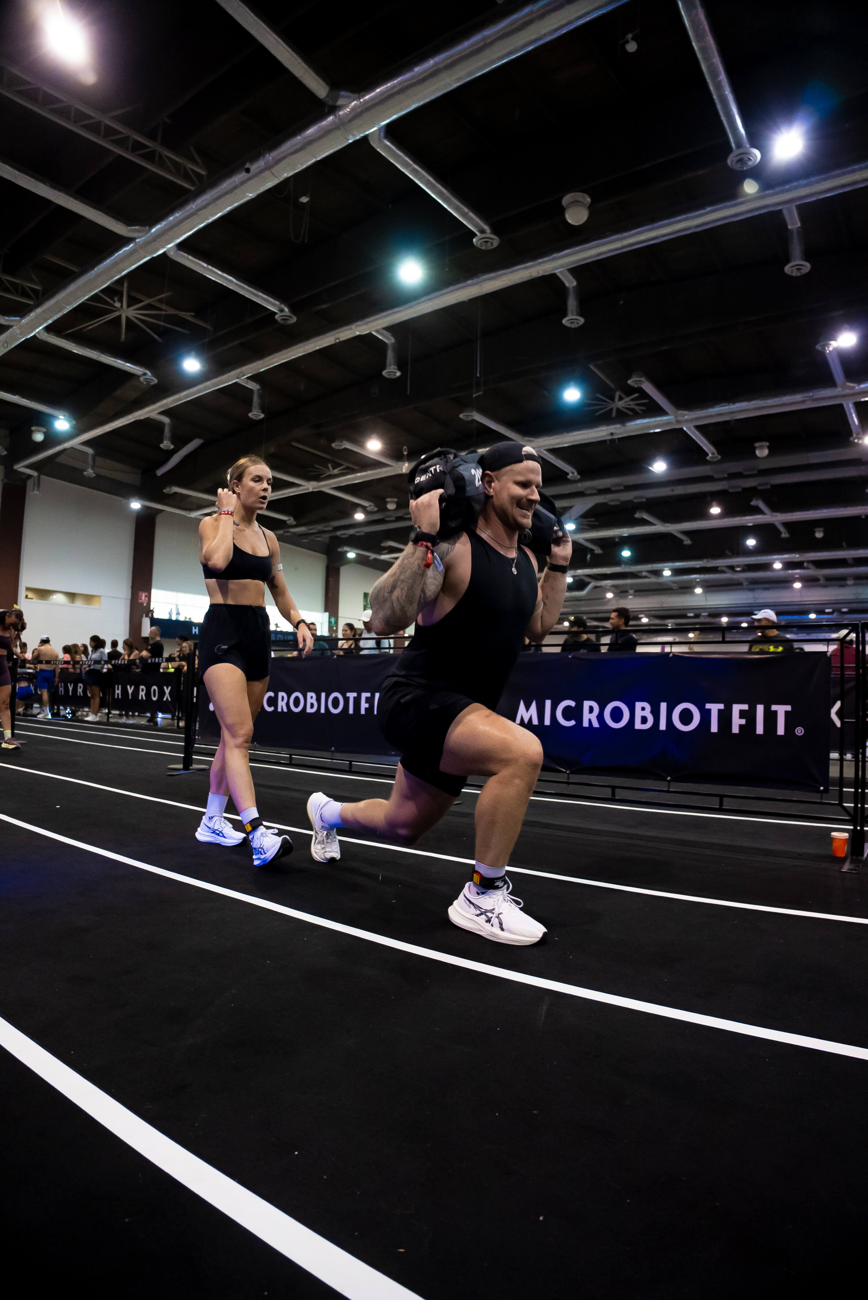 Call center agent looking to her screen on the side and smiling