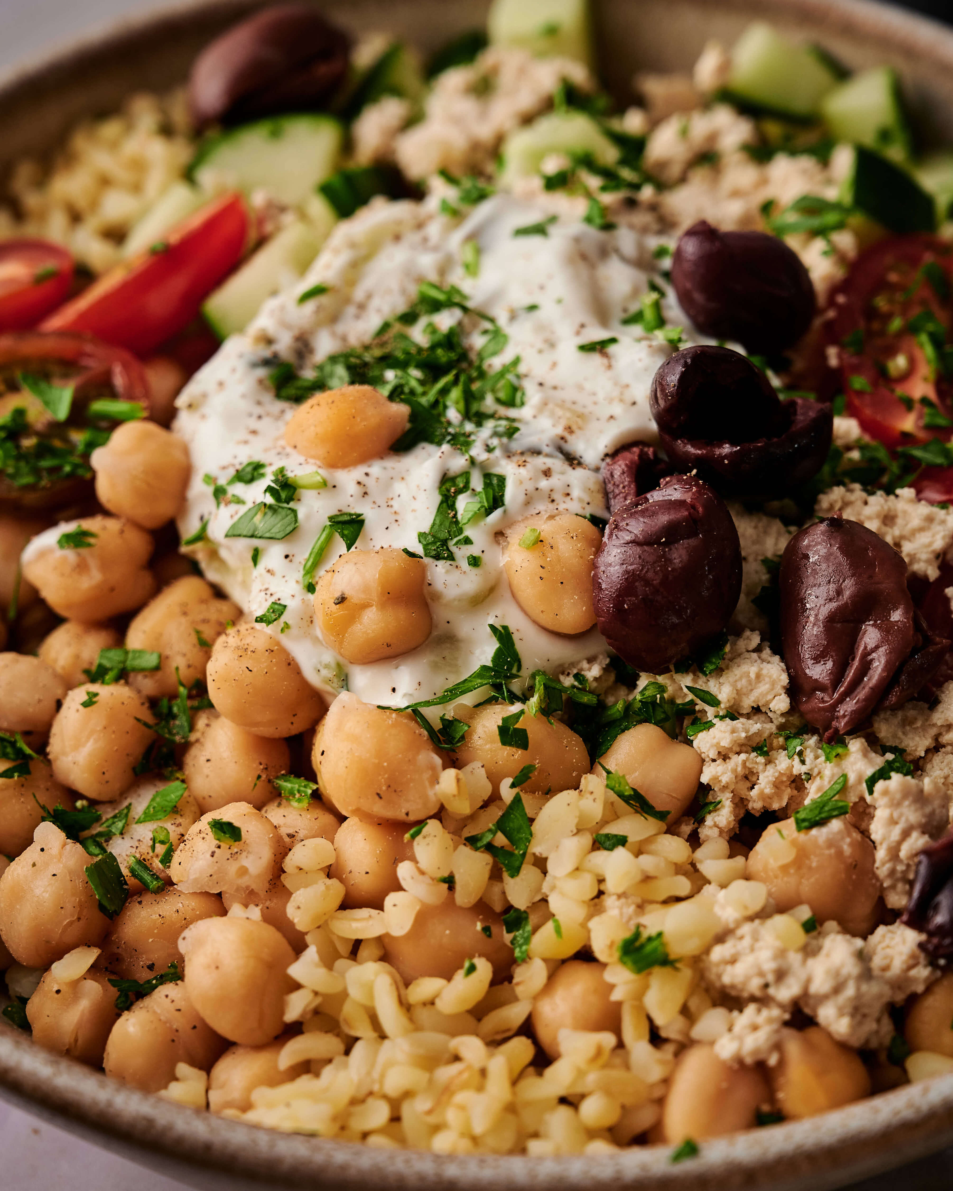 Call center agent looking to her screen on the side and smiling