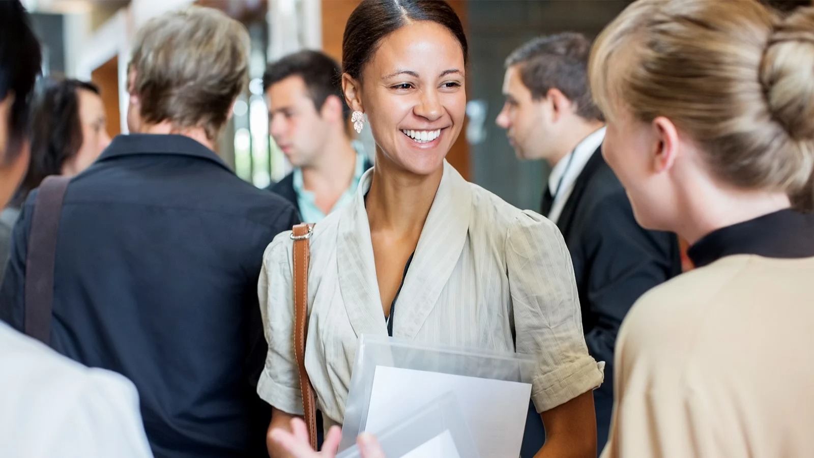 young woman networking in crowd