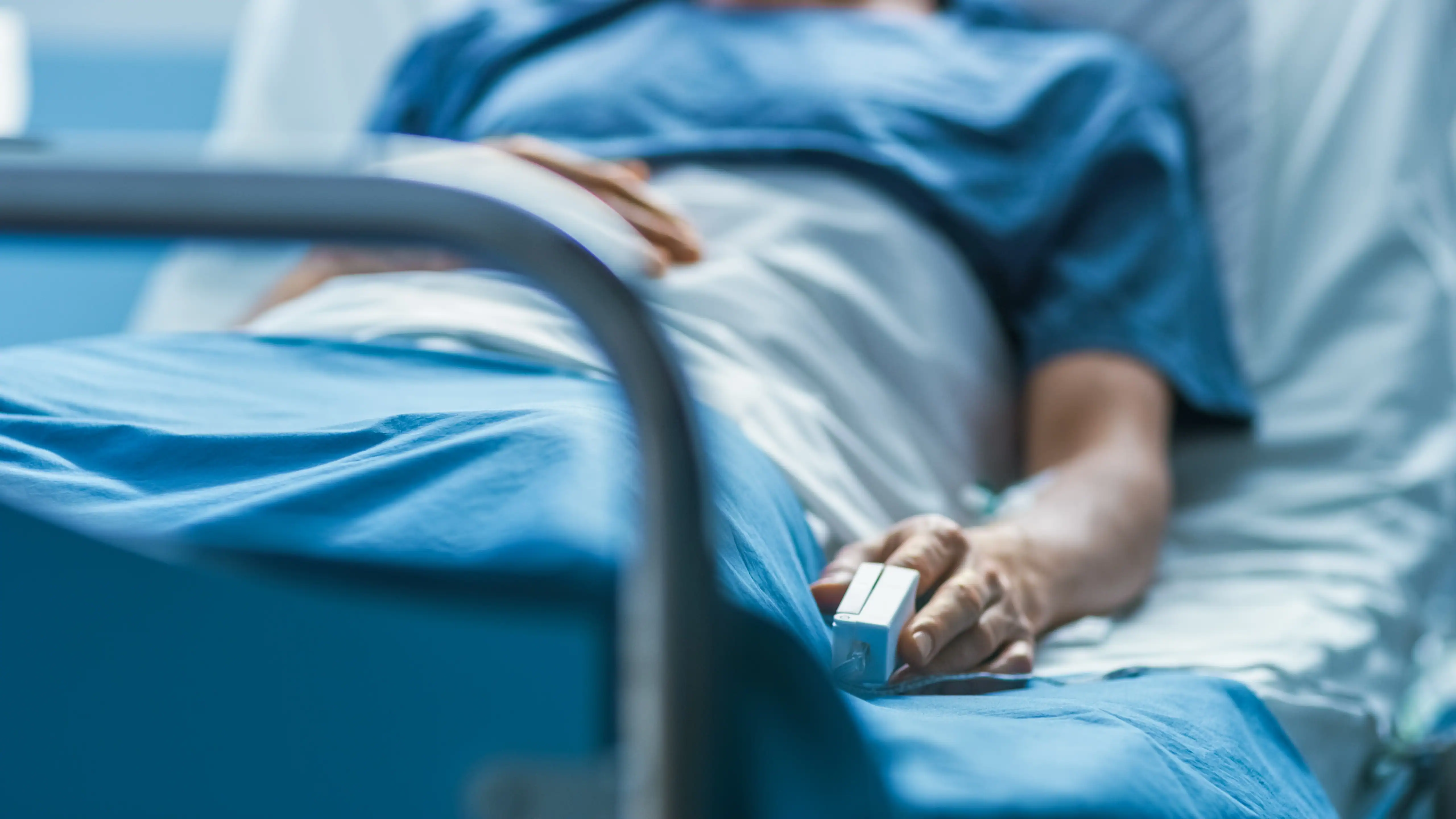 patient laying in hospital bed