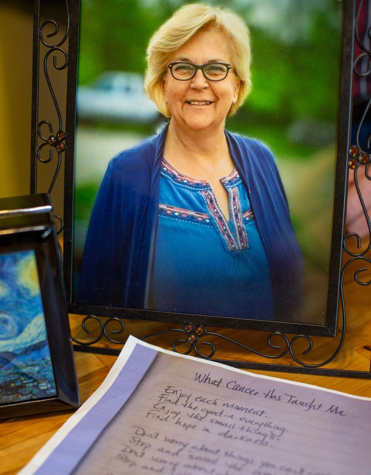 Picture frame of woman with list of "what cancer has taught me"